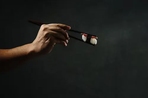 How do I hold chopsticks correctly?