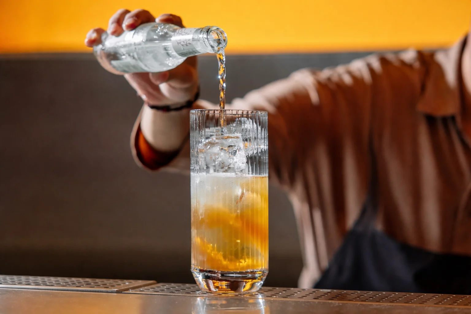 bartender preparing soda drink at Ram&Roll