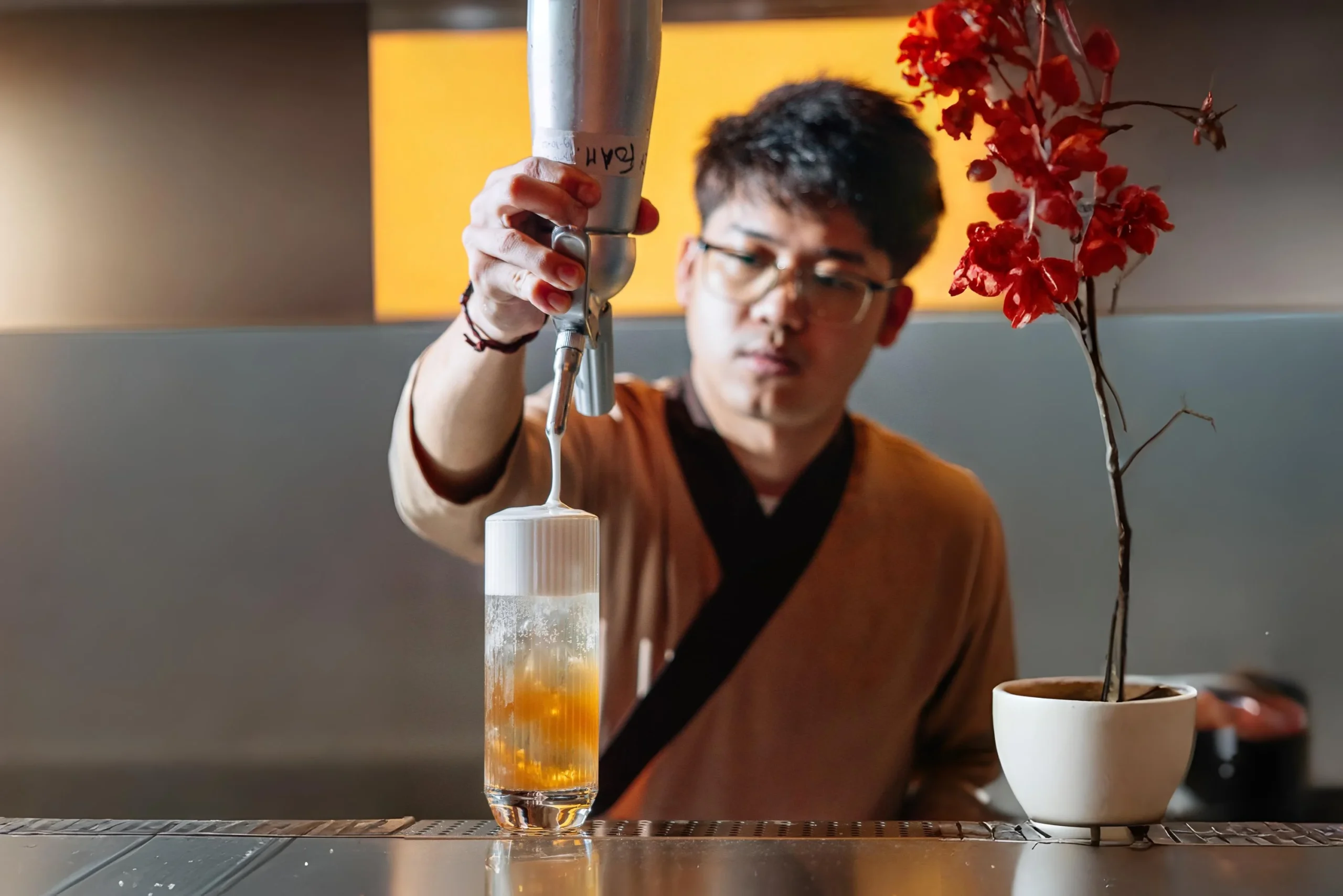 man preparing drink at Ram&Roll